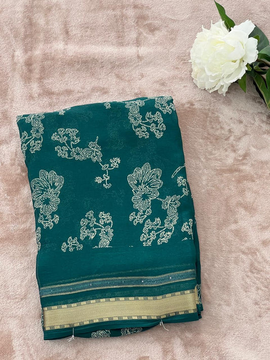 Emerald green saree folded showing full border and print
