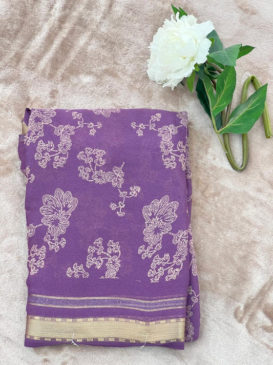 Dusty purple saree folded showing large cutdana floral work and gold zari border