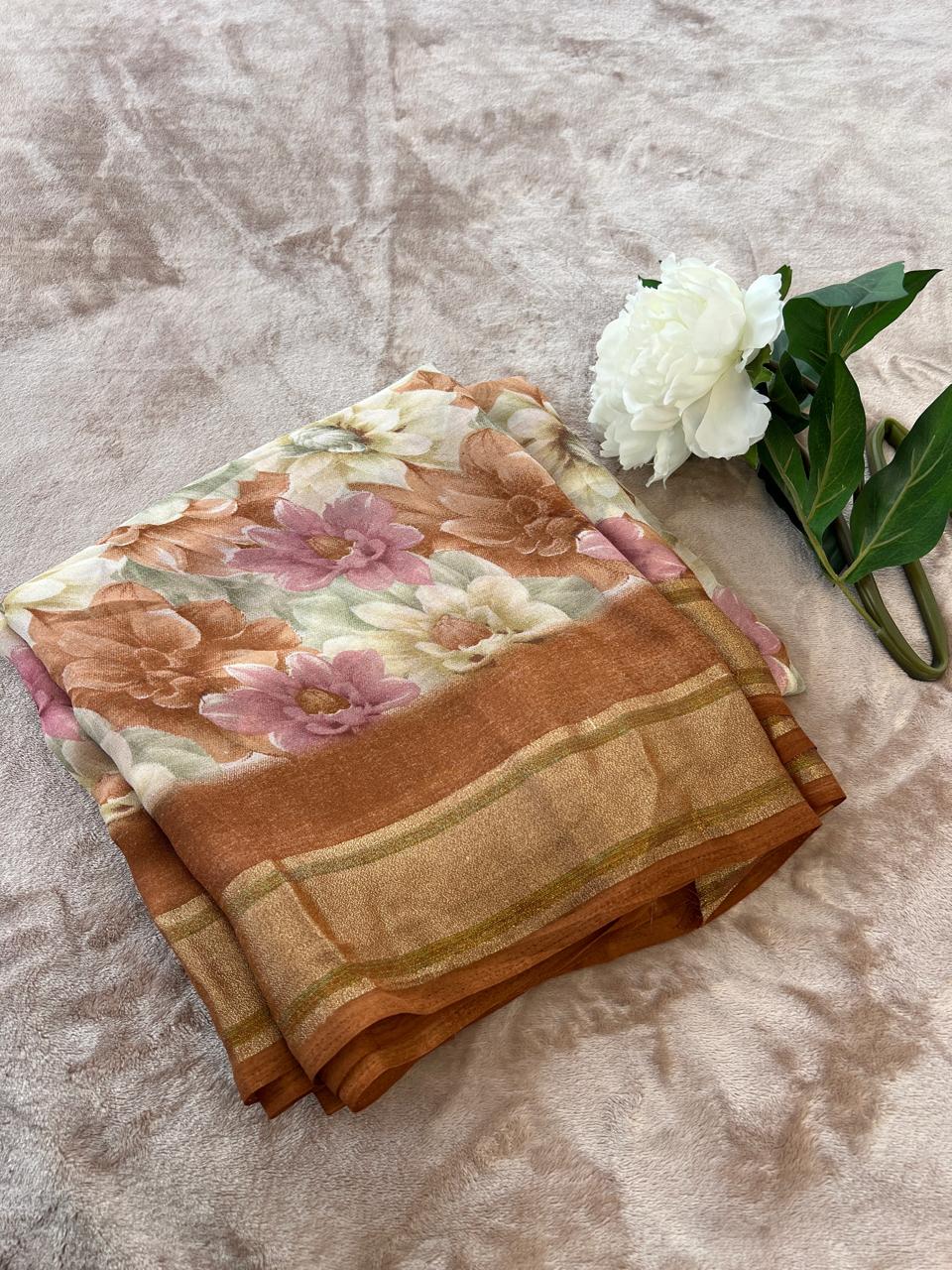 Rasmalai saree folded flat lay close-up showing copper zari border detail