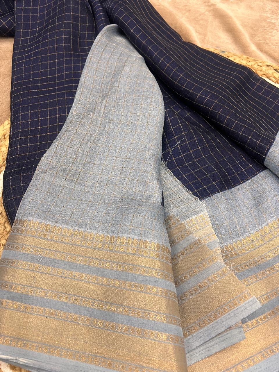 Powder blue pallu with gold zari border close-up