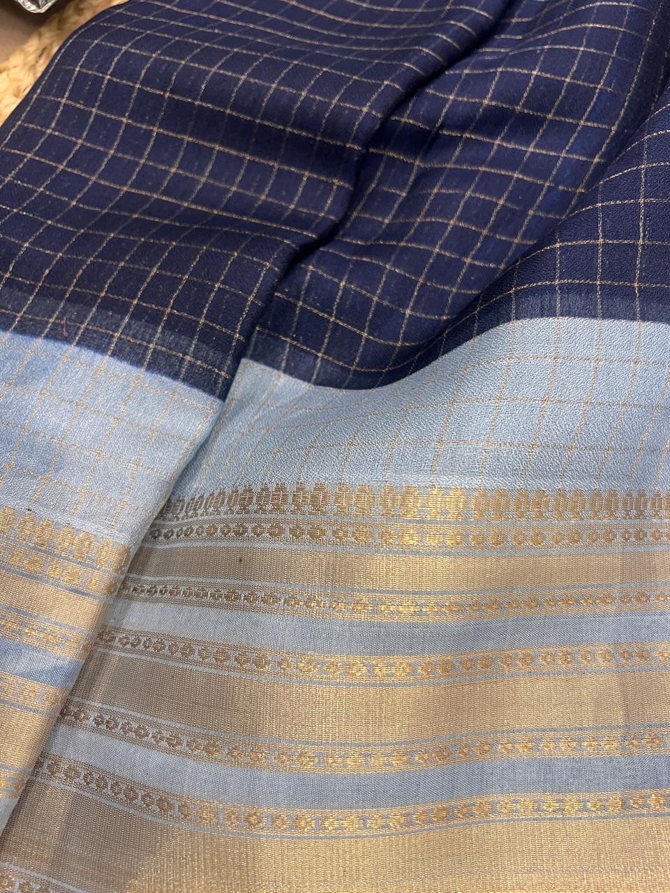 Gold zari check pattern fabric close-up