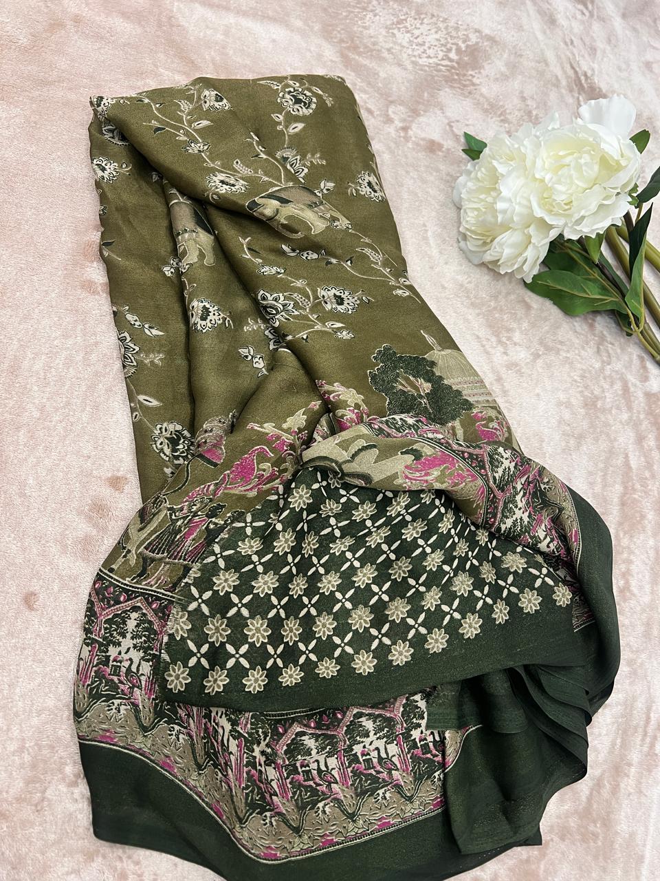 Elephant and floral Mughal print detail on olive green fabric