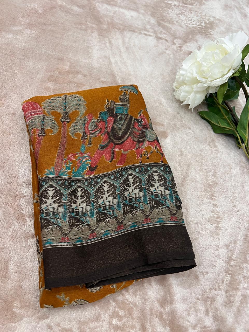 Mustard yellow saree folded flat lay with white peonies