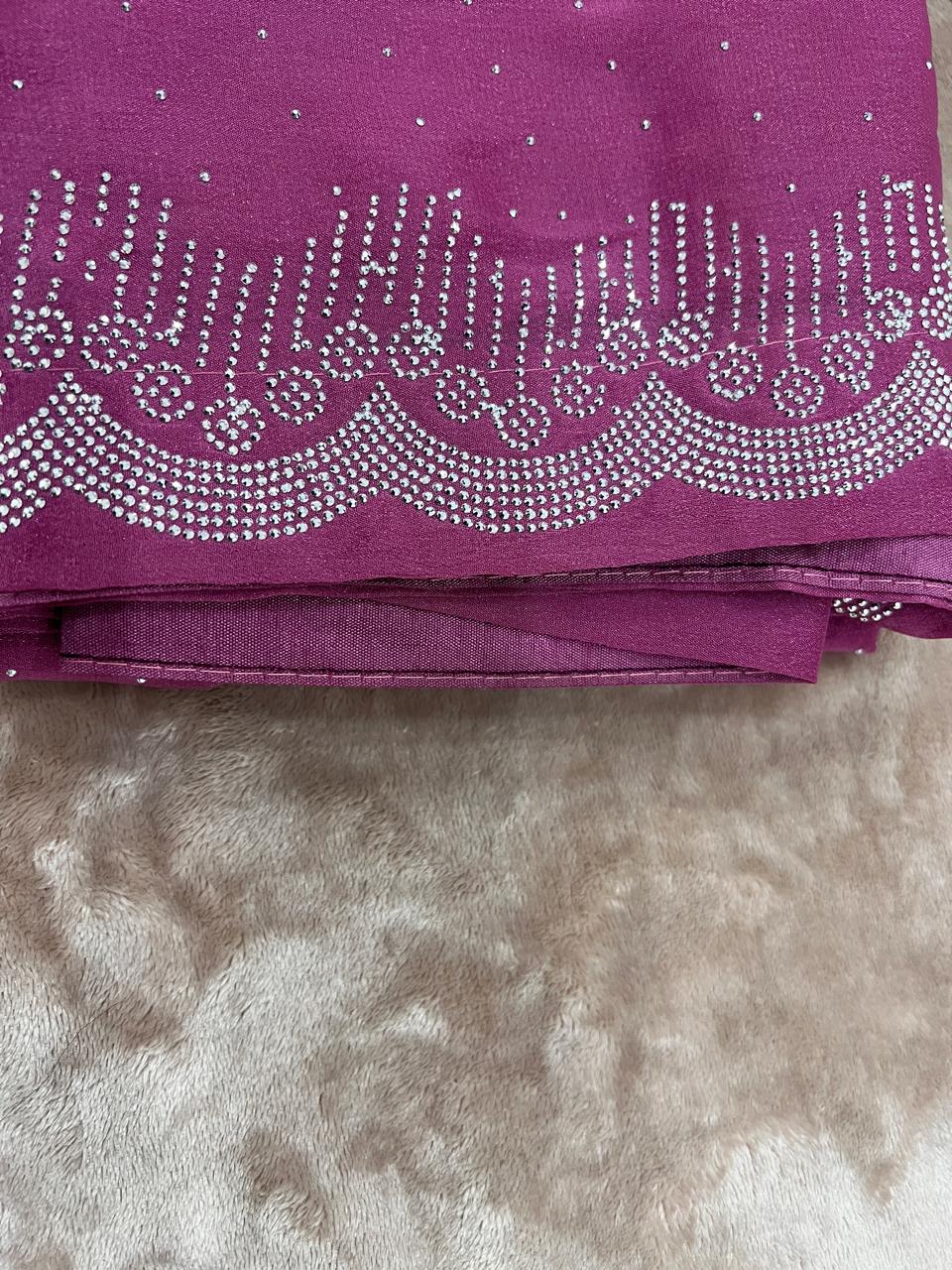 Magenta saree close-up showing intricate scalloped cutdana border crystal bead work
