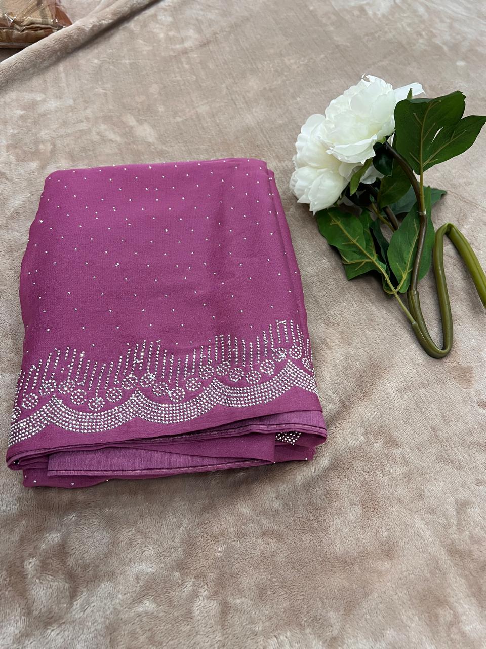 Magenta saree folded flat lay showing full cutdana dot body and scallop border