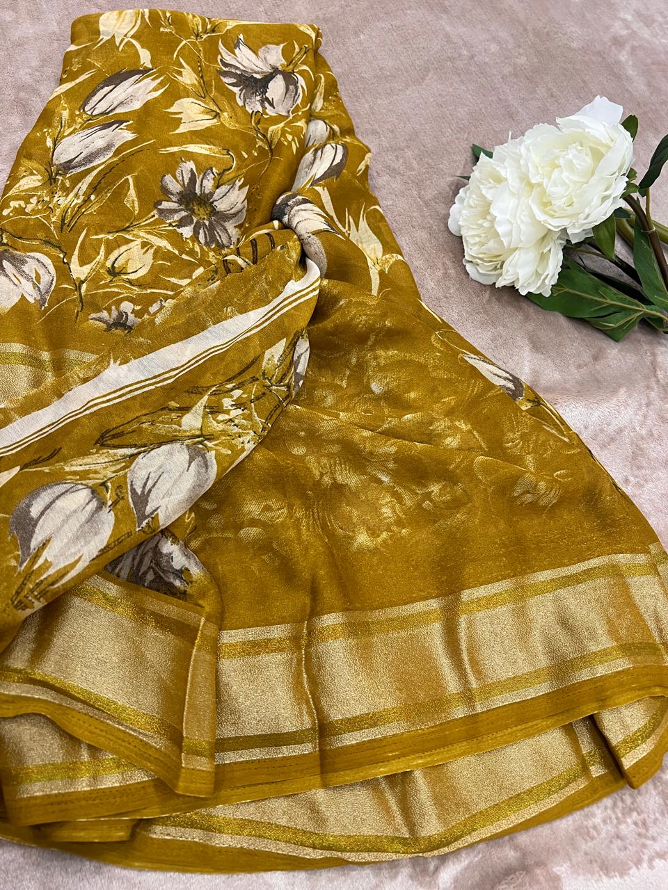 Rasmalai olive gold saree flat lay with white peony showing floral print and gold tissue border