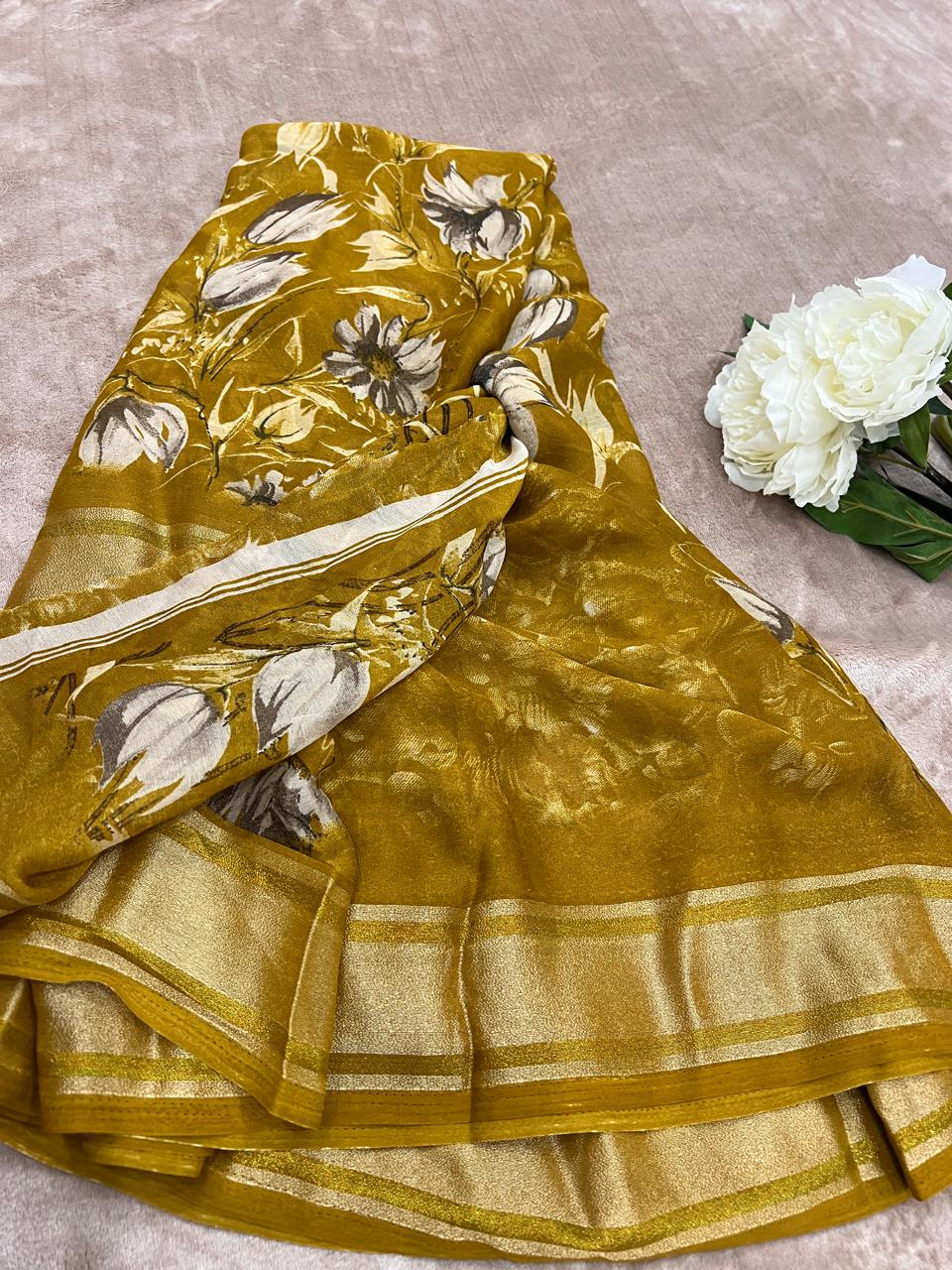 Rasmalai olive gold saree folded flat lay showing white floral print close-up
