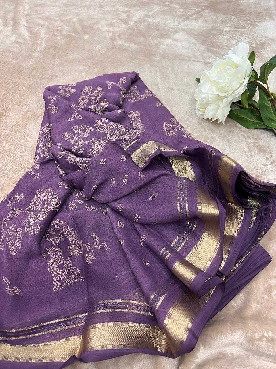 Dusty purple saree flat lay showing cutdana floral motifs and gold zari border