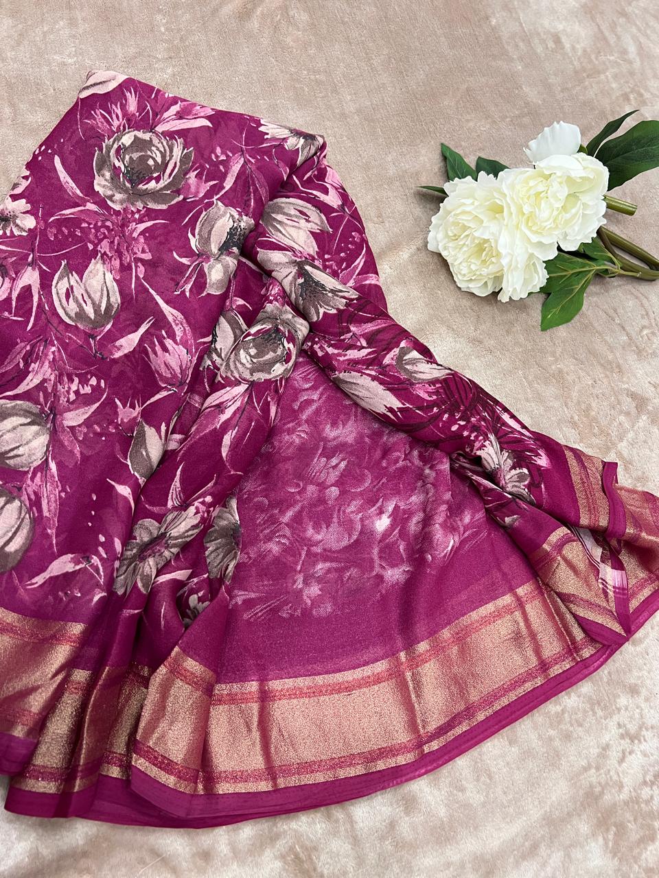 Rasmalai magenta saree flat lay with white peony showing large floral print and rose gold tissue border