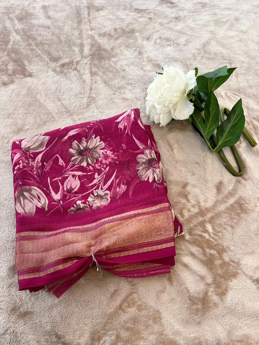 Rasmalai magenta saree folded flat lay showing daisy floral print and rose gold tissue border